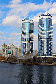 Residential complex Sunny riviera. Text on roof-UKRBUD. Two modern luxury skyscrapers against sky